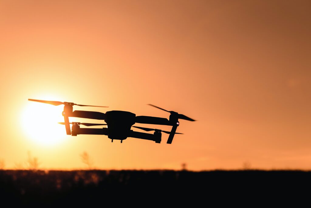 drone flying into the sunset